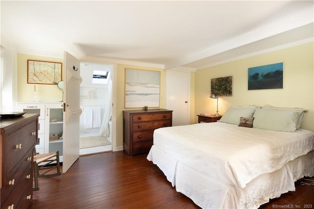 bedroom with dark hardwood / wood-style floors