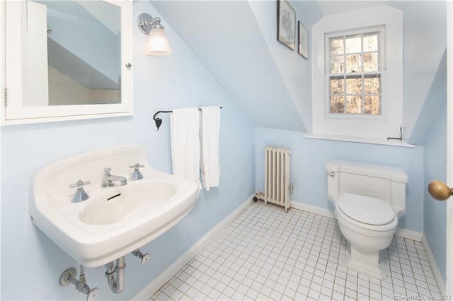 bathroom featuring radiator heating unit, toilet, tile flooring, and sink