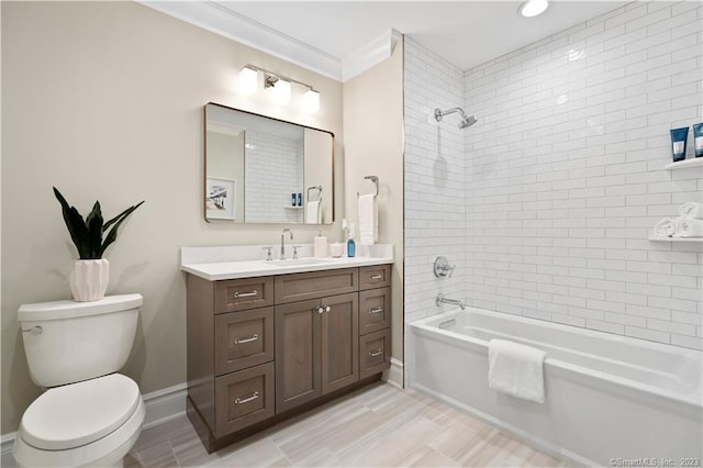 full bathroom featuring tiled shower / bath combo, crown molding, toilet, vanity, and tile floors