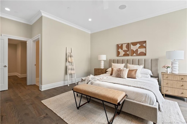 bedroom with crown molding and dark hardwood / wood-style floors