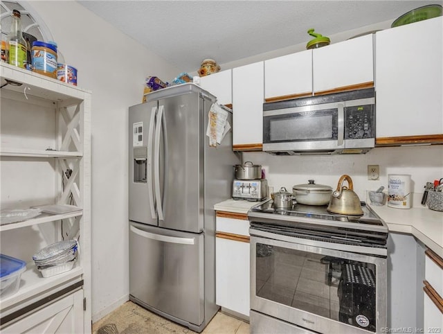 kitchen featuring white cabinetry and stainless steel appliances