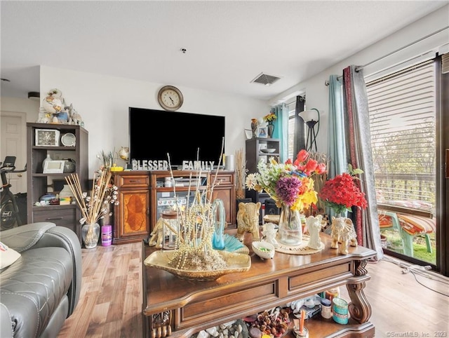 living room with light hardwood / wood-style floors