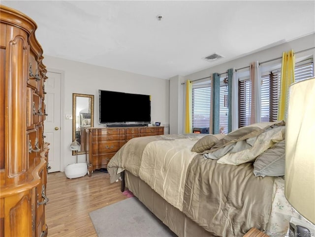 bedroom with light hardwood / wood-style floors