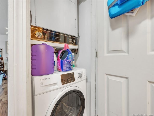 clothes washing area with stacked washer / drying machine