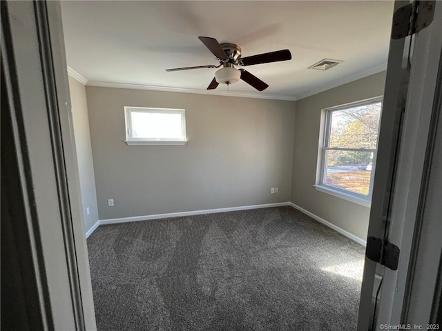 carpeted empty room featuring ornamental molding and ceiling fan