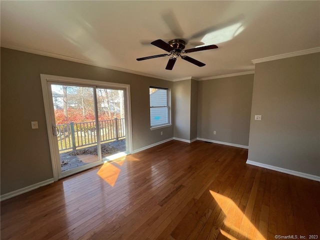 spare room with crown molding, ceiling fan, and dark hardwood / wood-style flooring