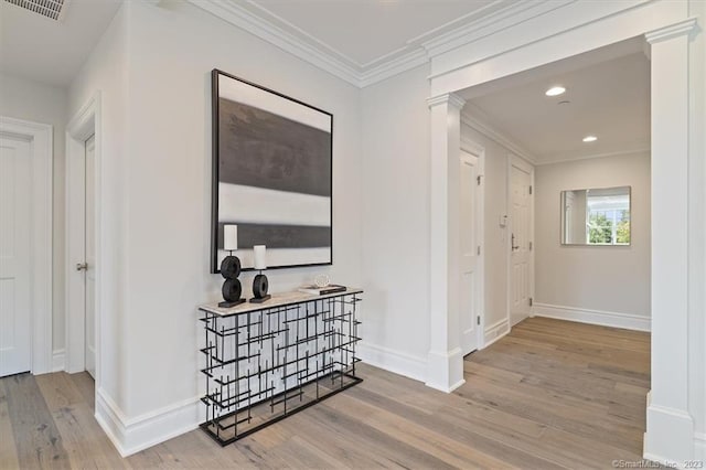 66 High St Unit 55, Guilford, CT 06437 - hallway featuring ornate columns, wood finished floors, crown molding, and recessed lighting