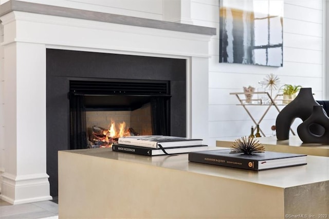 66 High St Unit 55, Guilford, CT 06437 - detailed view of a warm lit fireplace and baseboards