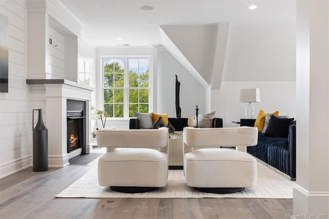 66 High St Unit 55, Guilford, CT 06437 - living room featuring a lit fireplace, wood finished floors, and recessed lighting