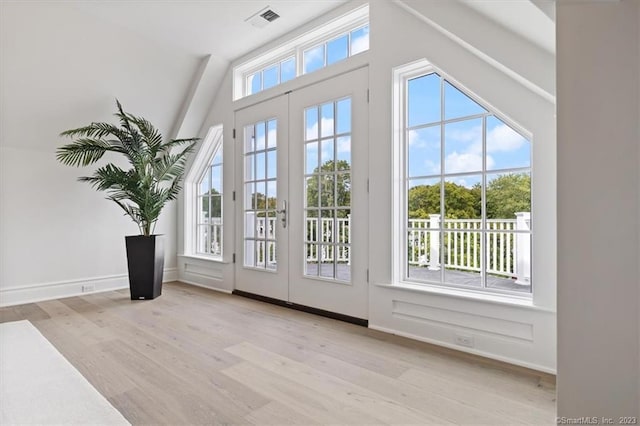 66 High St Unit 55, Guilford, CT 06437 - doorway with lofted ceiling, wood finished floors, and french doors
