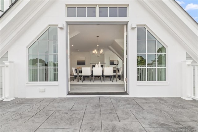 66 High St Unit 55, Guilford, CT 06437 - doorway to property with stucco siding and a patio area