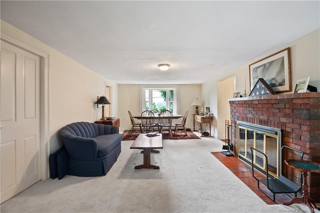living area with carpet floors and a brick fireplace