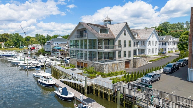 rear view of property featuring a water view