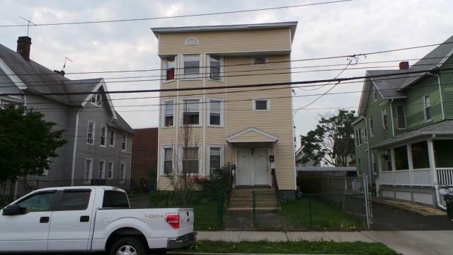 view of front of house featuring a balcony