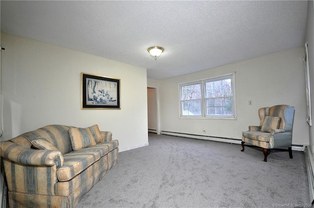 interior space featuring carpet floors, a textured ceiling, and a baseboard heating unit