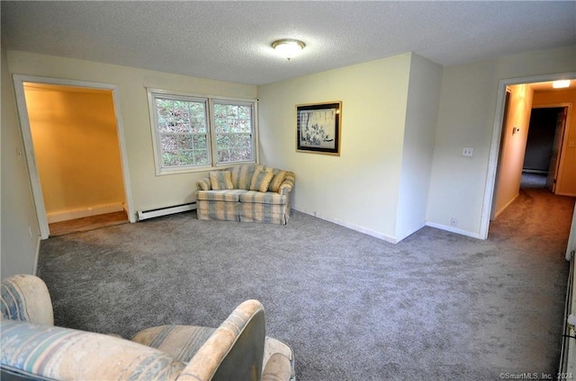 living area featuring a baseboard radiator, dark carpet, and a textured ceiling