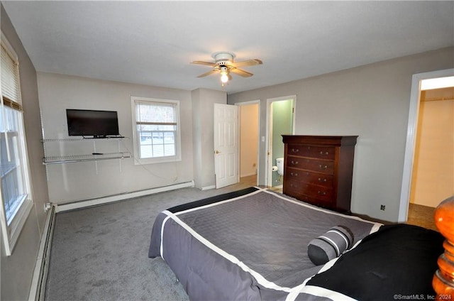 bedroom with a baseboard heating unit, ceiling fan, and dark carpet