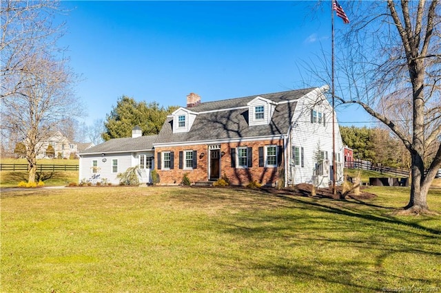 new england style home with a front lawn