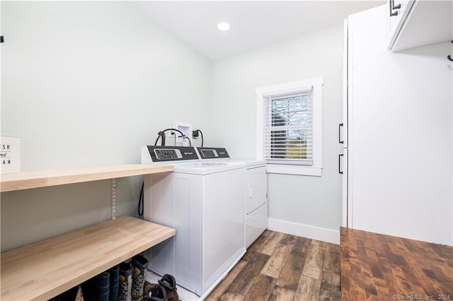 laundry area with washing machine and dryer and dark hardwood / wood-style floors