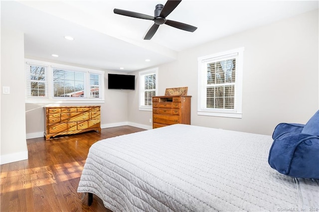 bedroom with ceiling fan and hardwood / wood-style flooring