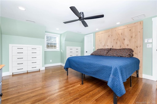 bedroom featuring hardwood / wood-style floors and ceiling fan