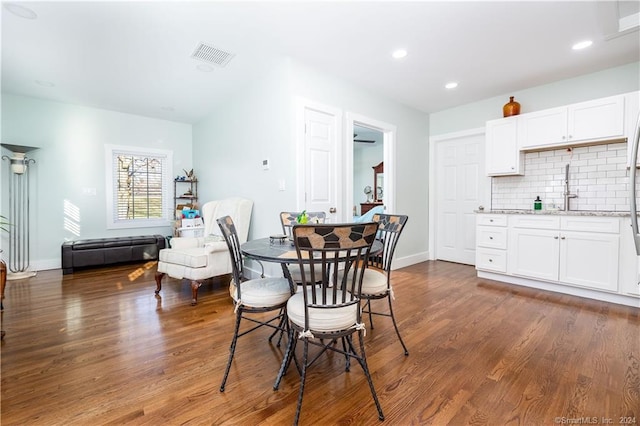 dining room with dark hardwood / wood-style floors