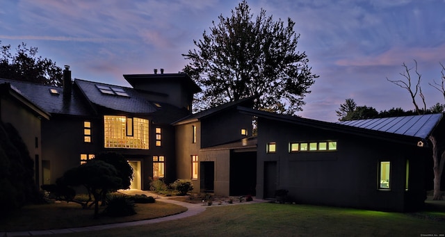 view of front of home with a lawn