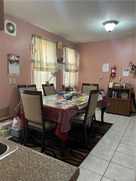 dining area with light tile floors