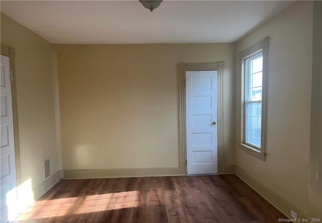 empty room featuring dark hardwood / wood-style floors