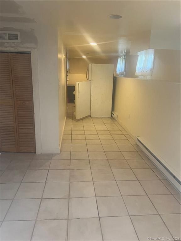 hallway with light tile floors