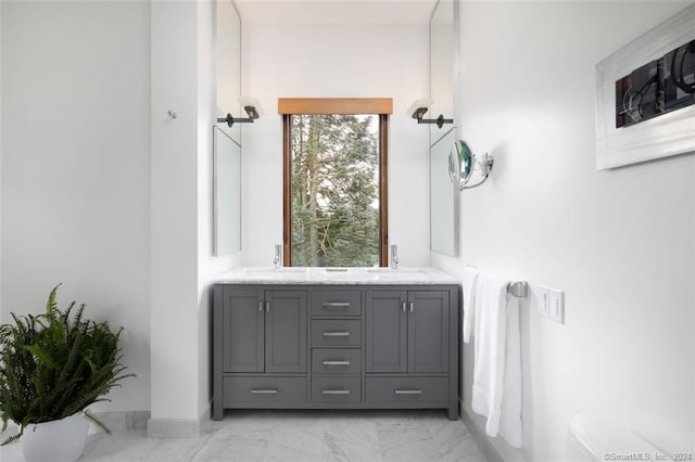 bathroom featuring double sink vanity and tile floors