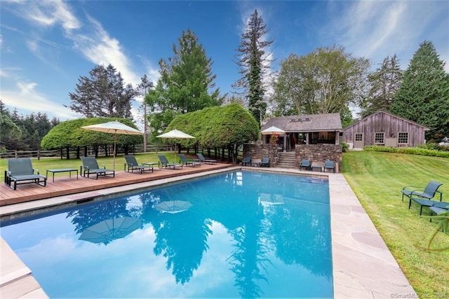 view of pool featuring a yard