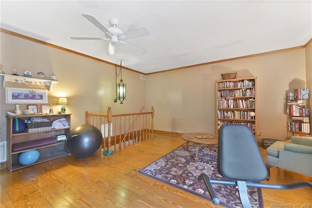 office space with crown molding, light hardwood / wood-style floors, and ceiling fan