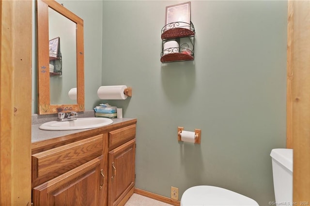 bathroom featuring toilet and vanity