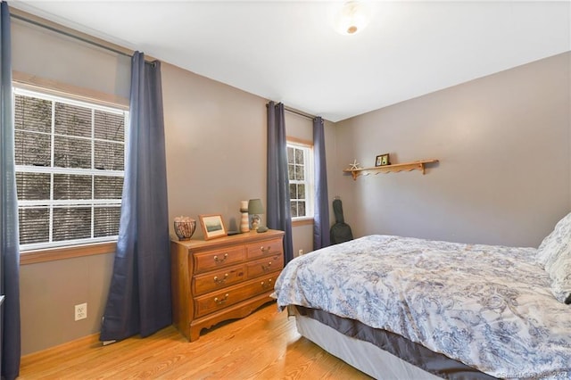 bedroom with light hardwood / wood-style flooring