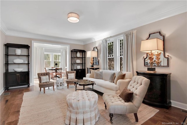 living room with crown molding and dark wood-type flooring