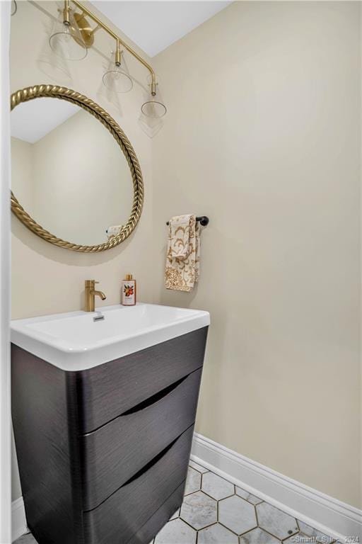 bathroom featuring tile flooring and vanity