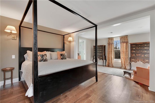 bedroom with wood-type flooring