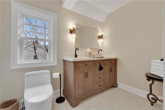 bathroom featuring toilet, vanity, vaulted ceiling, and tile flooring