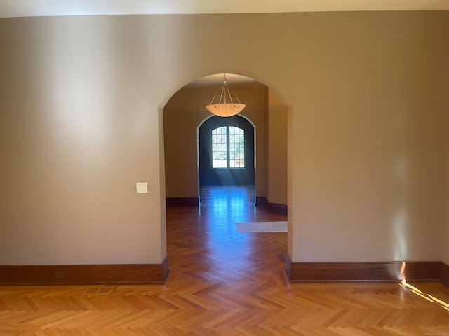 hallway with parquet flooring