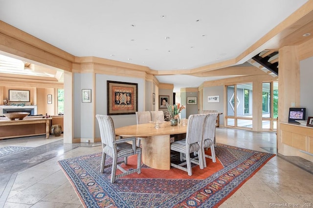 dining space featuring light tile flooring and lofted ceiling with beams