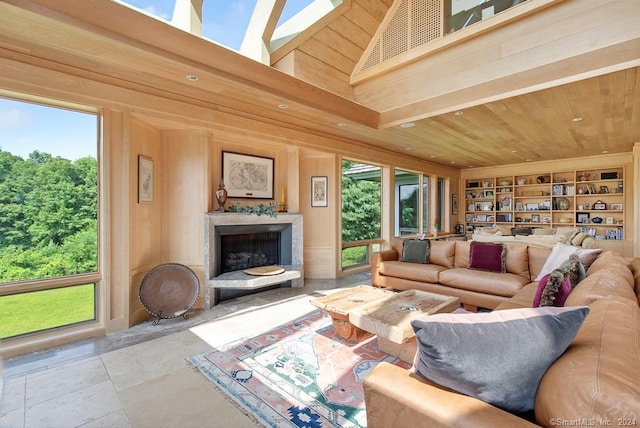 living room featuring light tile flooring, wooden ceiling, a towering ceiling, and built in features