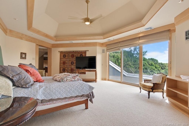 bedroom featuring a raised ceiling, access to exterior, ceiling fan, and light carpet