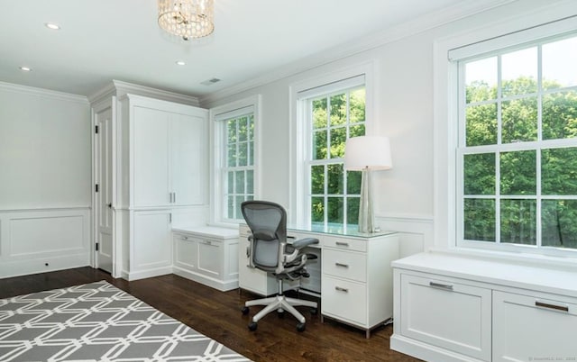 home office featuring visible vents, wainscoting, dark wood-style floors, ornamental molding, and a decorative wall