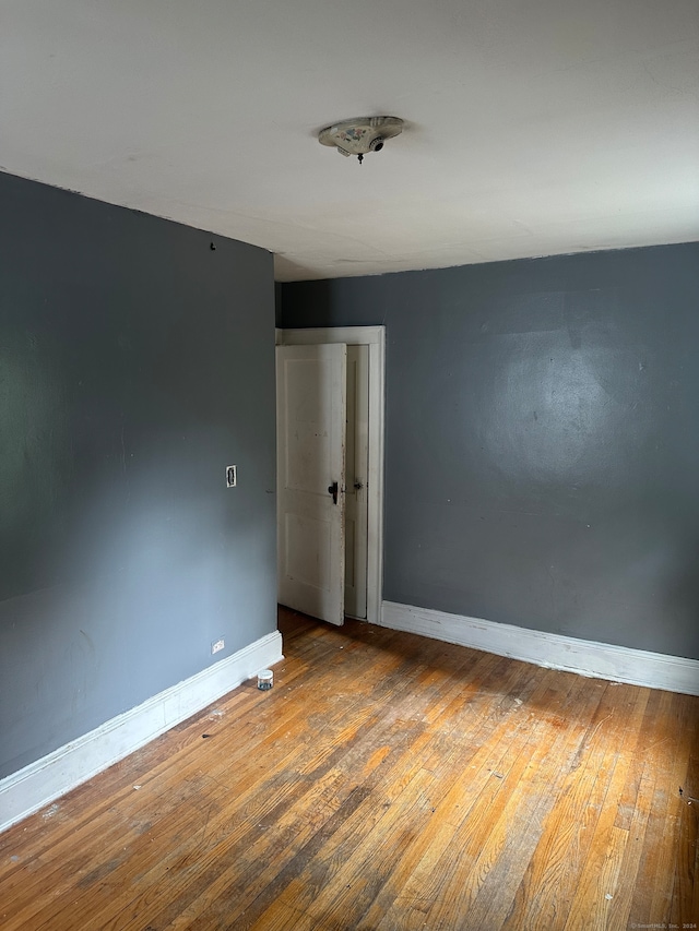 empty room featuring hardwood / wood-style flooring