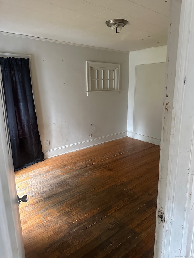 empty room featuring dark hardwood / wood-style floors