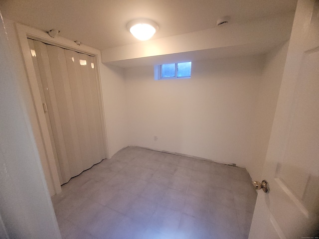 basement featuring light tile floors