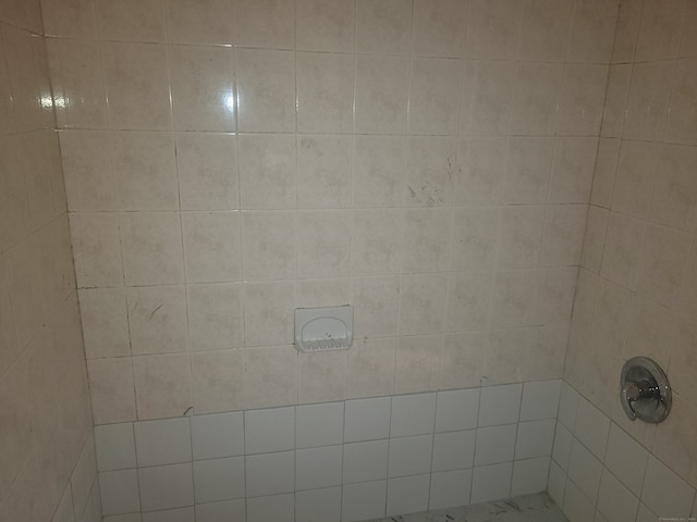 room details with a tile shower