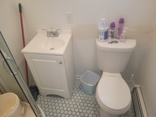 bathroom with vanity, tile floors, a baseboard radiator, and toilet