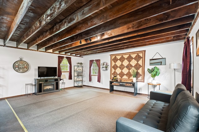 living room with beam ceiling and a fireplace